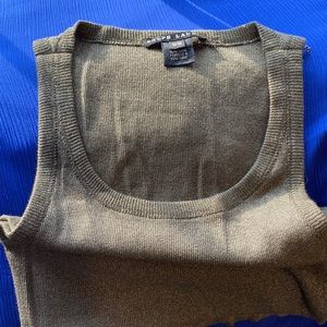 Fun shimmery darling green tank has snaps to keep your bra straps in place